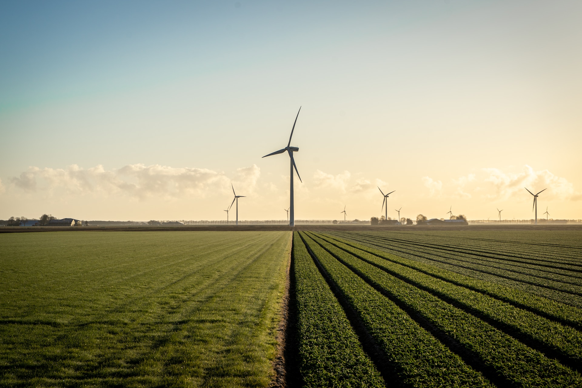 Wind mill generating clean energy, a renewable resource that can help reduce the carbon footprint of the fashion industry.