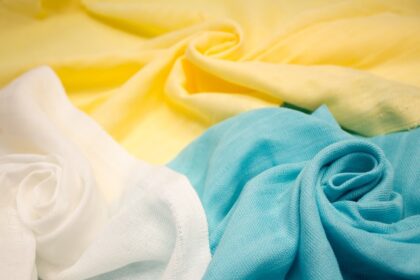 Close-up view of sustainable, environmentally friendly textile fabric, showcasing the texture and natural color of eco-conscious material.