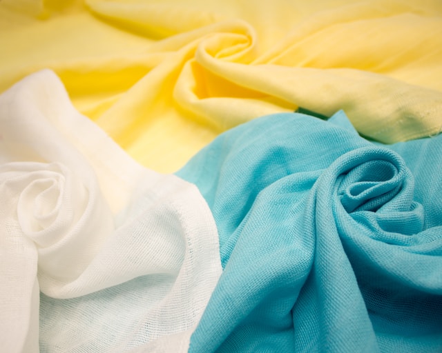 Close-up view of sustainable, environmentally friendly textile fabric, showcasing the texture and natural color of eco-conscious material.